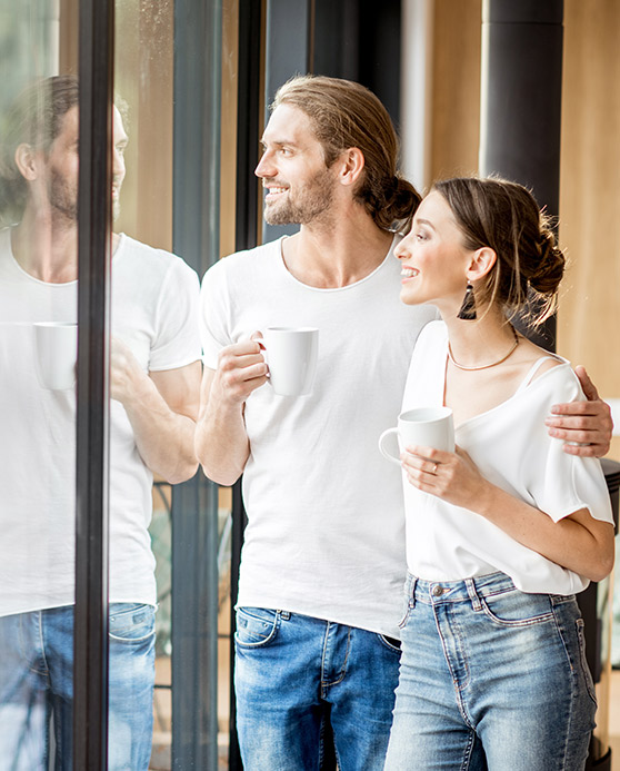 Couple Looking out the window together