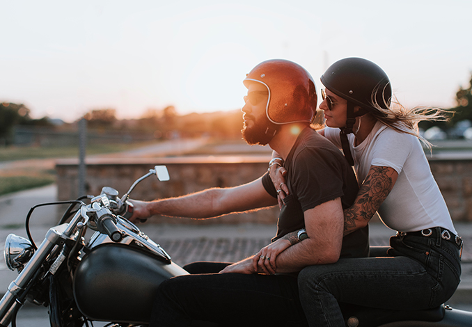 Couple riding motorcycle