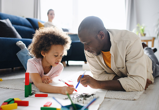 Father and daughter playing together