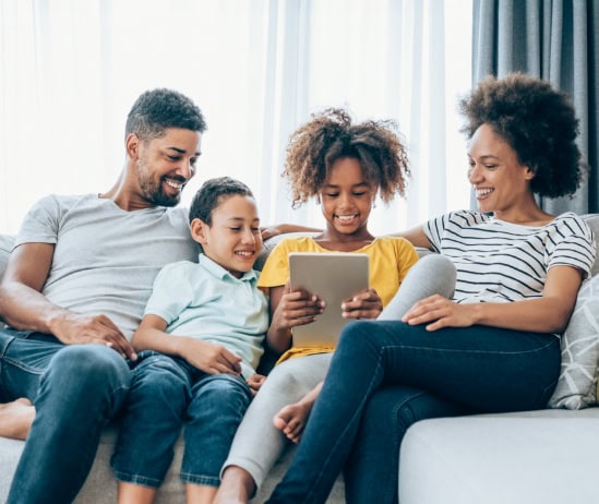 Smiling family in the living room