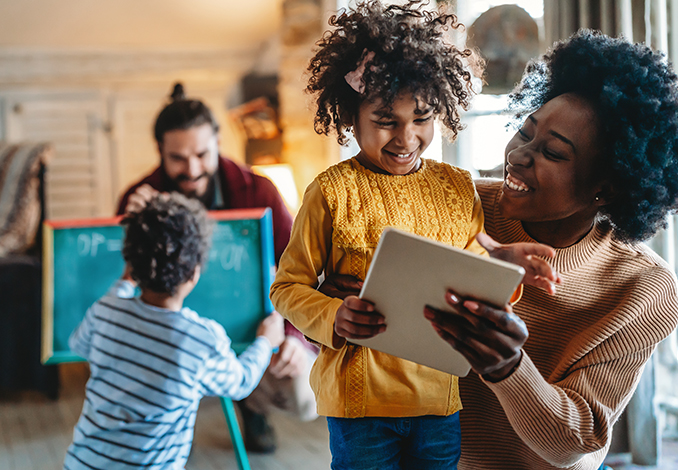 Mom and daughter using tablet