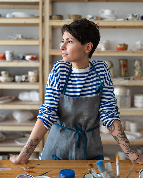 Small business owner in blue striped shirt
