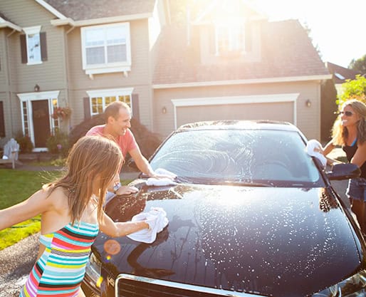 Family washing car.